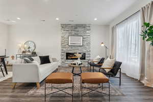 Living room featuring a fireplace and dark hardwood / wood-style floors