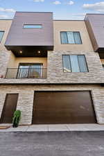 View of building exterior featuring a garage