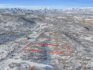 Snowy aerial view with a mountain view