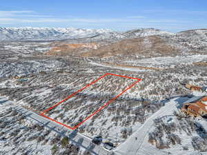 Snowy aerial view featuring a mountain view