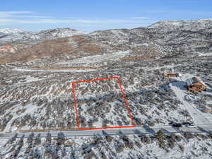 Snowy aerial view with a mountain view