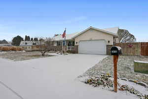 Single story home featuring a garage