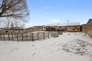 Snowy yard with a storage unit