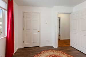 Bedroom featuring dark wood-type flooring