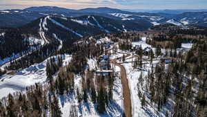 Snowy aerial view with a mountain view