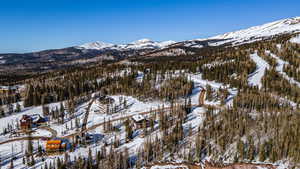 Snowy aerial view with a mountain view