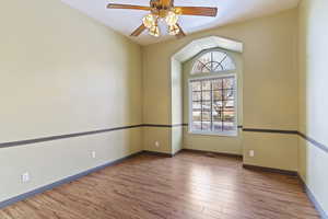 Spare room featuring ceiling fan and light hardwood / wood-style flooring