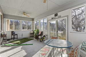 Sunroom featuring ceiling fan