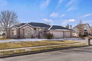 Ranch-style home featuring a garage