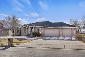 Ranch-style house featuring a garage