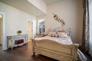 Bedroom featuring dark hardwood / wood-style floors