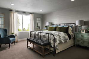 Carpeted bedroom featuring a textured ceiling