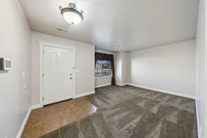 View of carpeted foyer entrance