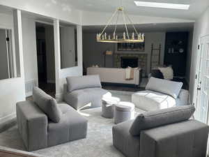 Living room featuring hardwood / wood-style floors and a skylight