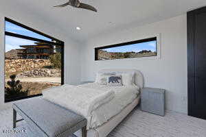 Bedroom with vaulted ceiling and ceiling fan