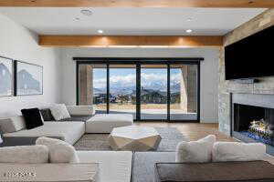 Living room featuring a fireplace and beamed ceiling