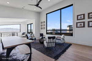 Dining space featuring wood-type flooring and ceiling fan