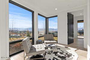 Sunroom with a mountain view