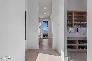 Corridor with light wood-type flooring