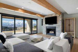 Living room featuring beamed ceiling and hardwood / wood-style flooring