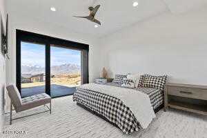 Bedroom featuring access to outside and ceiling fan