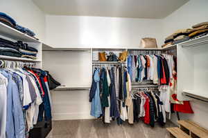 Spacious closet featuring carpet flooring