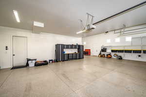 Garage featuring a garage door opener