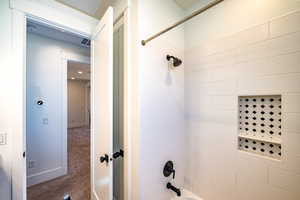 Bathroom featuring shower / washtub combination