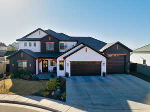 Modern farmhouse with a garage and covered porch