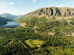 Property view of mountains with a water view