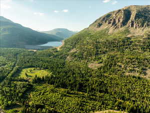 Property view of mountains featuring a water view