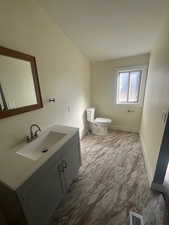 Bathroom featuring toilet and vanity