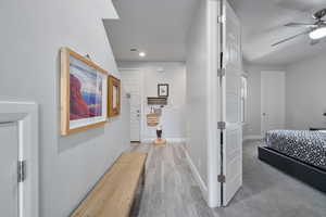 Hallway with wood-type flooring