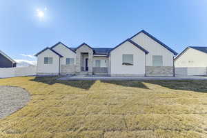Modern farmhouse with a front lawn