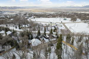 Snowy aerial view with a mountain view