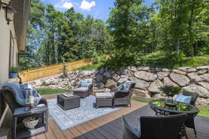 Wooden deck featuring an outdoor living space