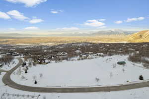 Snowy aerial view with a mountain view