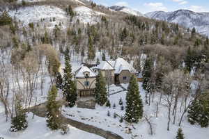 Snowy aerial view featuring a mountain view