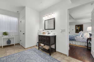 Bathroom featuring wood-type flooring and vanity