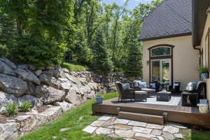 View of patio featuring outdoor lounge area and a wooden deck