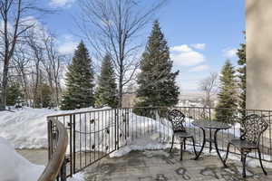 View of snow covered back of property