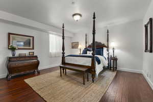 Bedroom featuring dark hardwood / wood-style flooring