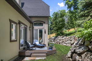 View of yard featuring a wooden deck