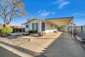 Manufactured / mobile home featuring a carport