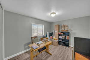 Office area featuring hardwood / wood-style flooring