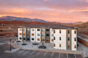 Outdoor building at dusk with a mountain view