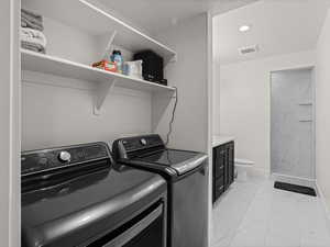 Clothes washing area with washing machine and dryer