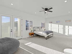 Bedroom featuring light carpet, access to exterior, and ceiling fan
