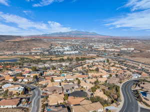 Birds eye view of property with a water and mountain view