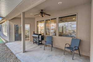 View of patio with a grill and ceiling fan